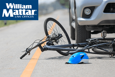 Bicycle in road that has been hit by a vehicle
