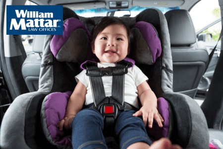 baby secured safely in car seat