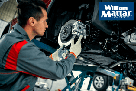 mechanic repairing brakes