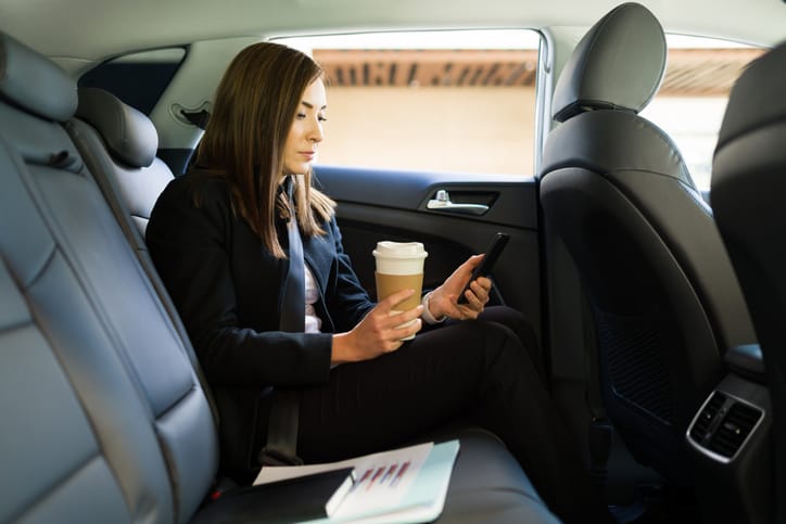 woman working in back of a rideshare