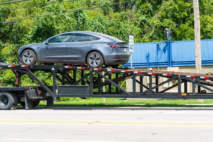 Tesla being unloaded from Delivery Semi truck