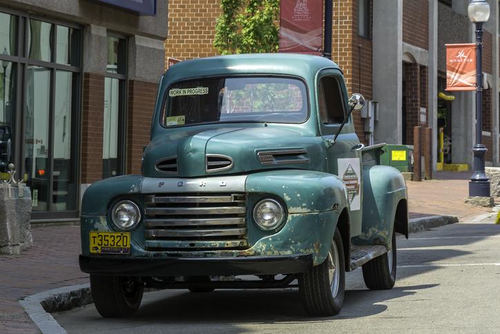 1949 green Ford pickup truck parked