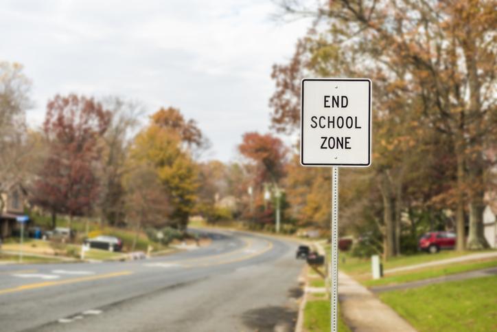 Public End School Zone sign on road