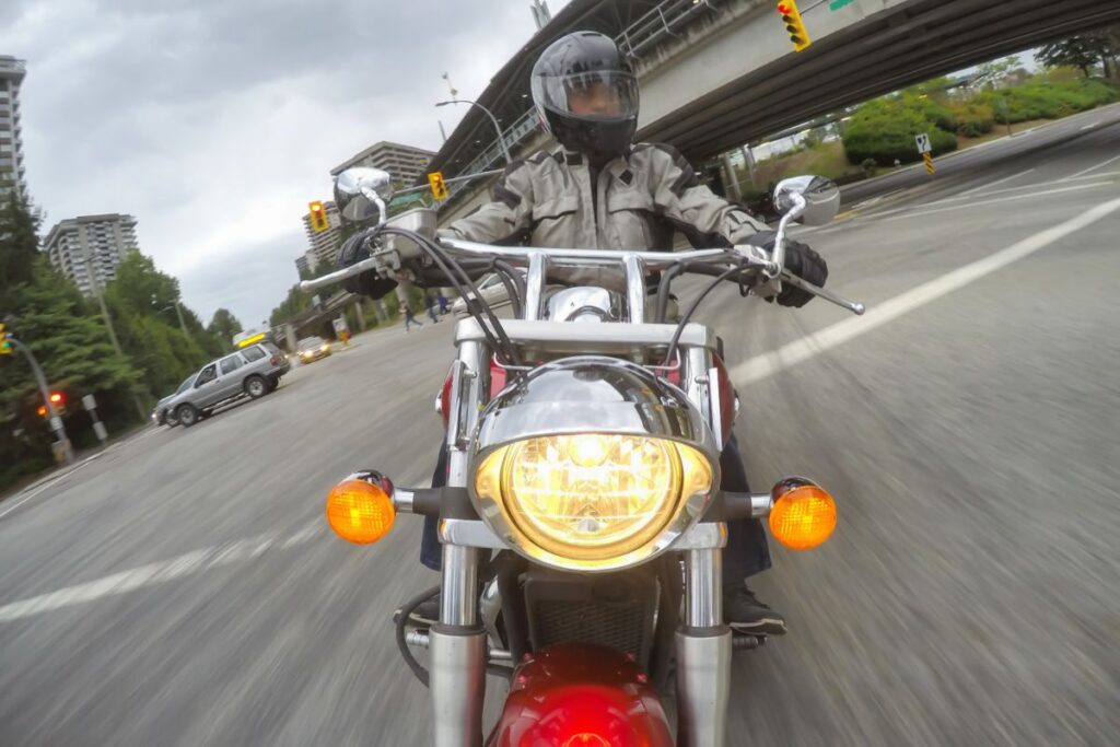 man riding motorcycle in Syracuse New York street