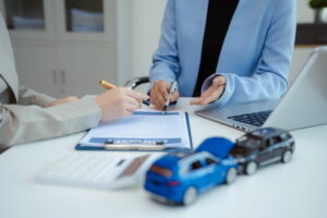 Person filling out car accident claim