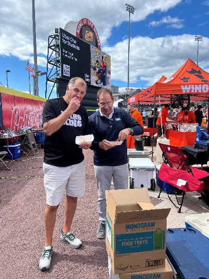 William Mattar attorneys sampling wings at the National Buffalo Wing Festival